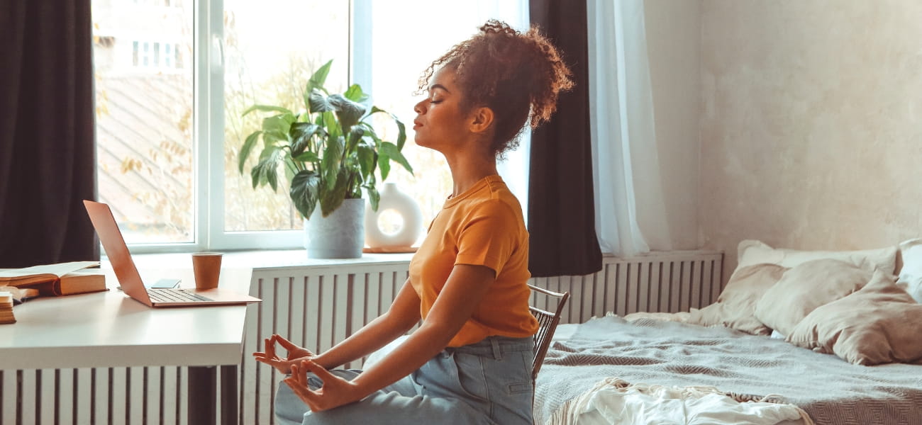 Woman practicing deep breathing technique to reduce anxiety