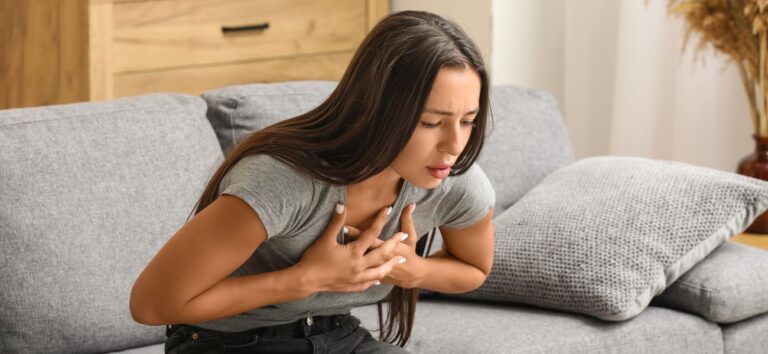 Woman experiencing a panic attack with chest tightness