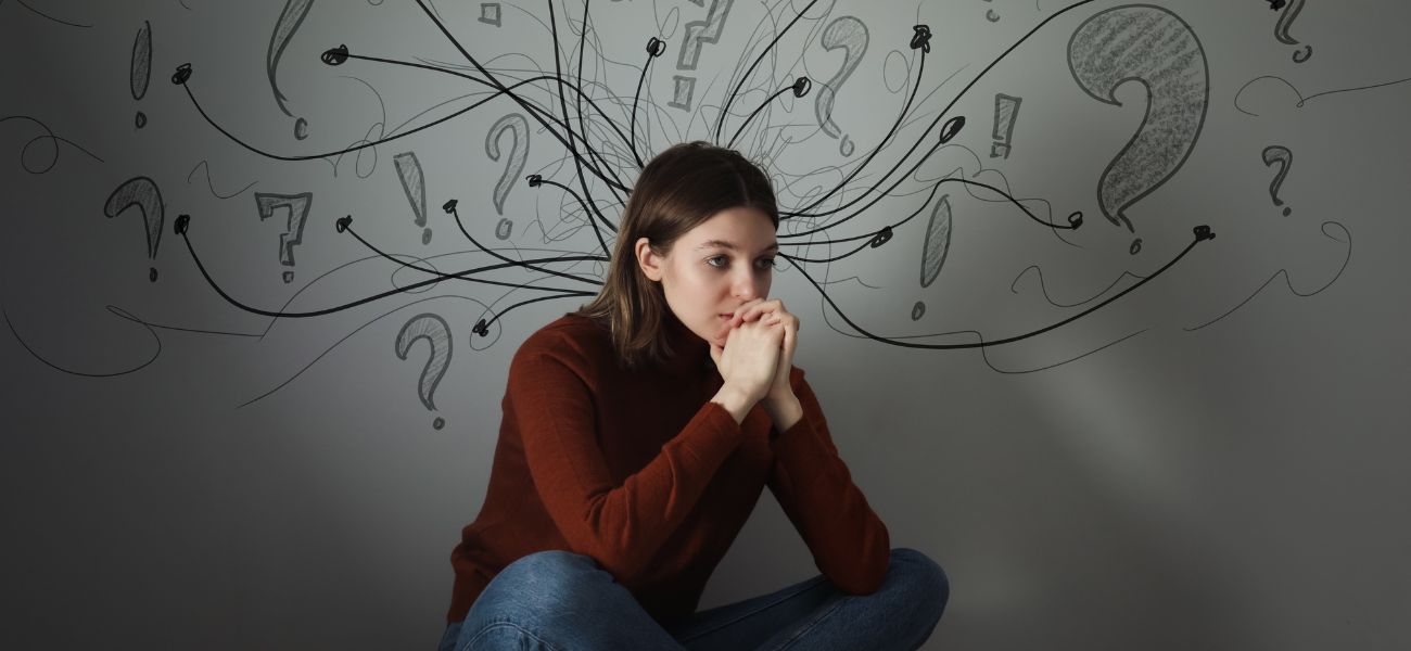 Woman experiencing intrusive thoughts and anxiety related to OCD