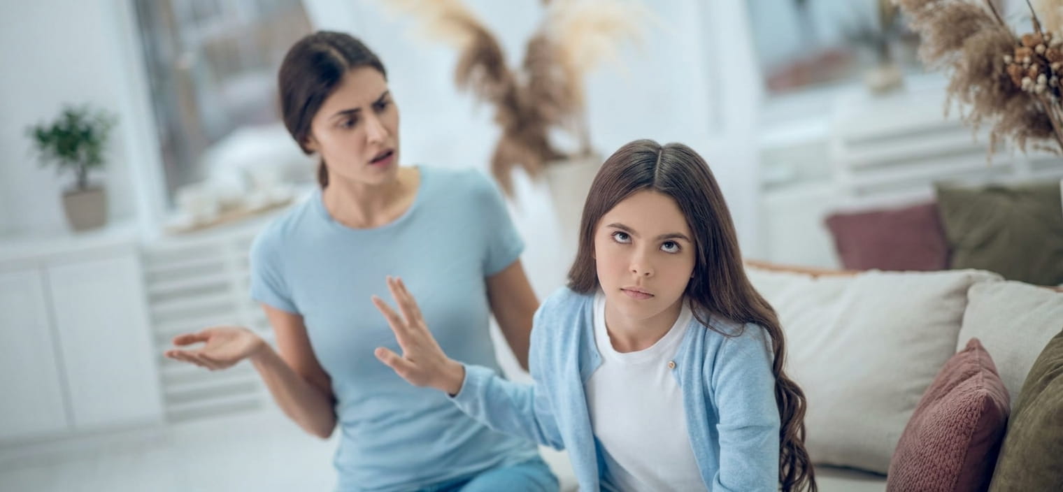 Teenager with oppositional behavior arguing with mother